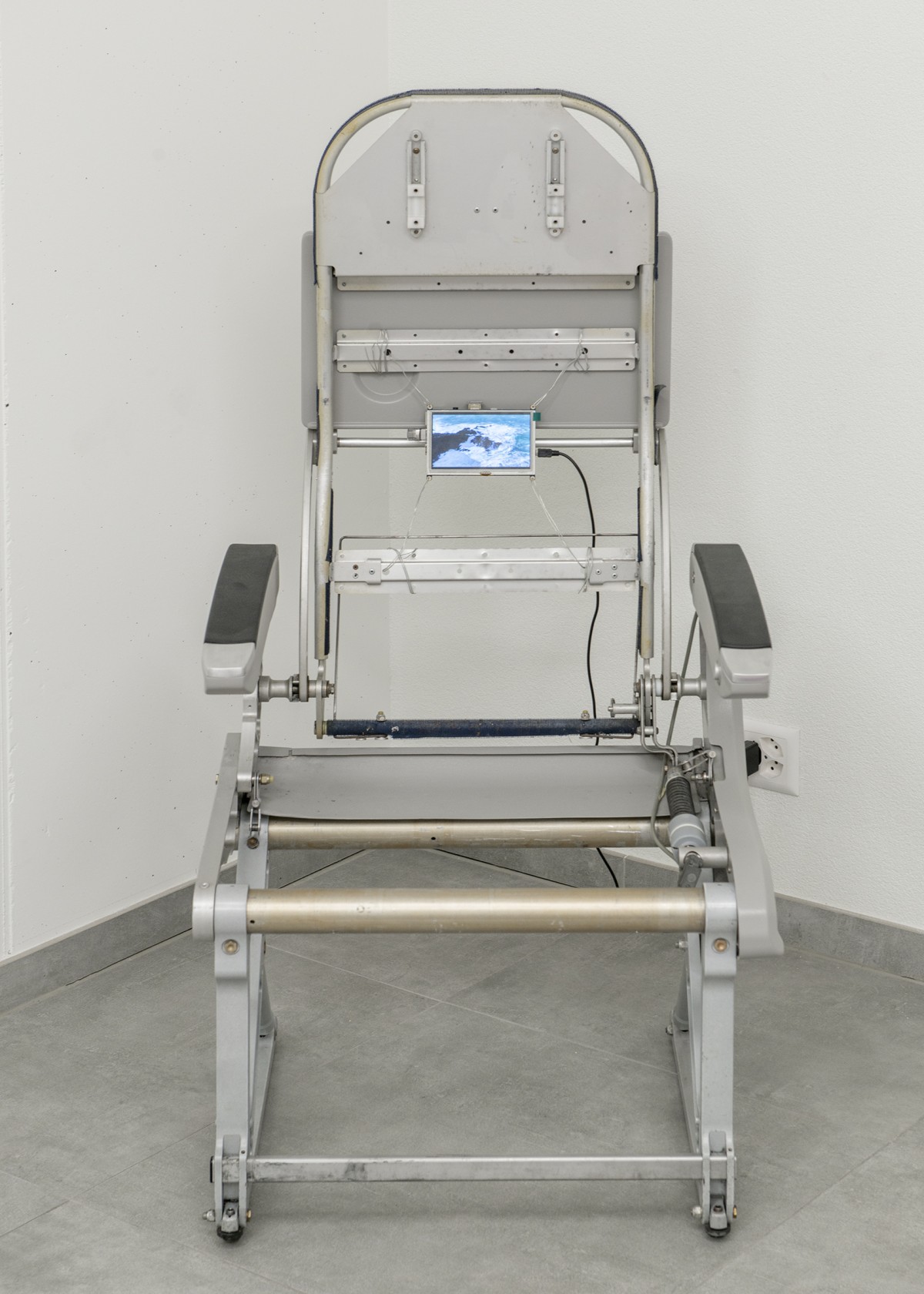 Rafik Greiss, Left to my own devices, 2021, airplane chair with video on LCD screen - All Stars Lausanne